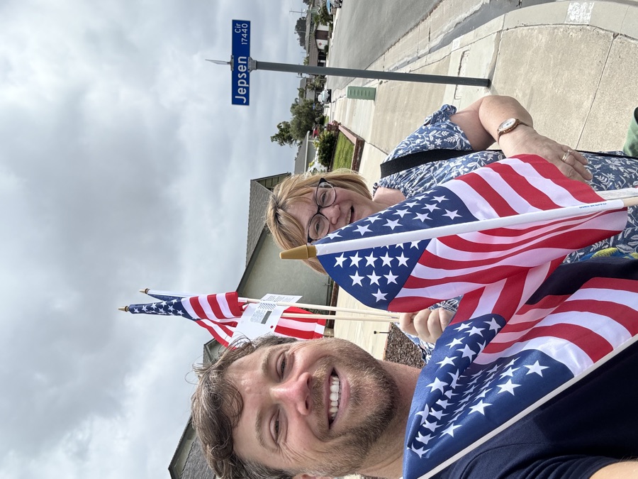Barbara and David distributing flags